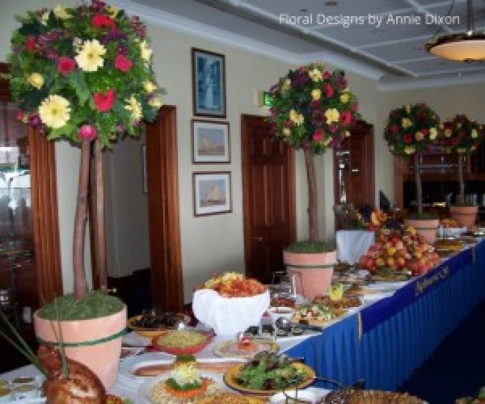 Brightly coloured topiary trees on buffet table