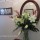Vase arrangement of November Lilies and Spider Orchids in entrance hall