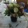Arrangement of Cymbidium Orchids, Roses and Bouvardia in small tin bucket