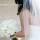Bride with her ivory rose bouquet