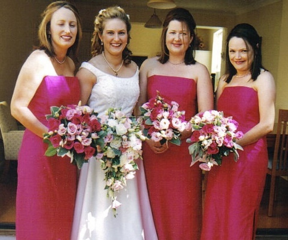 White and hot pink bouquets to complement bridal colour scheme