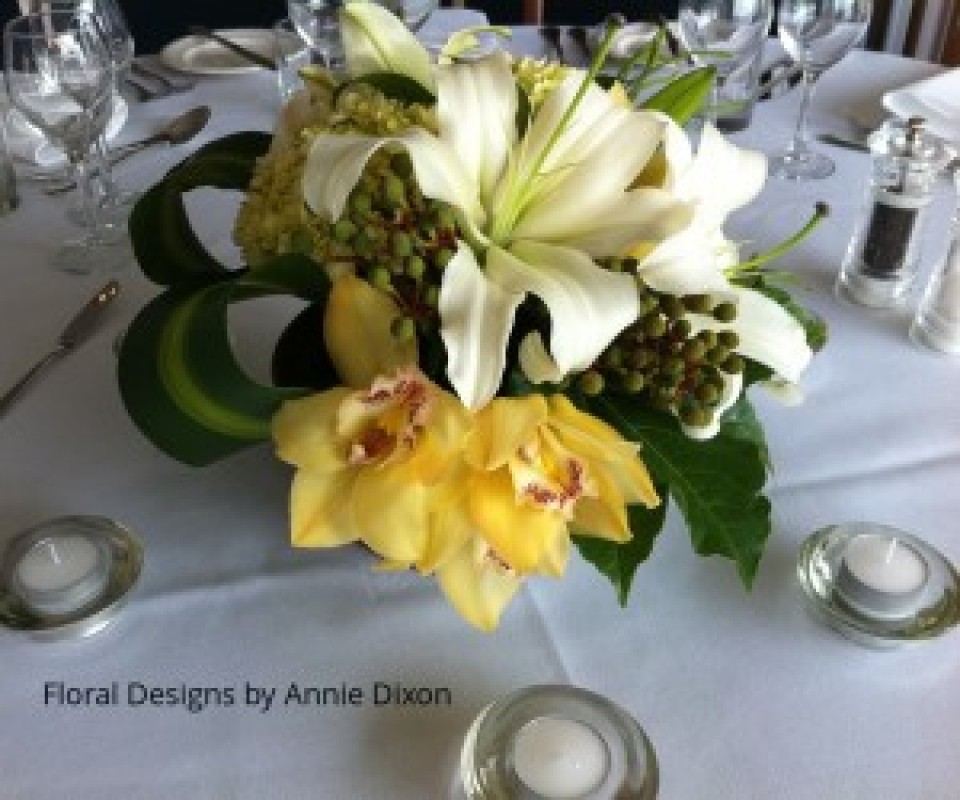 Corporate dinner - yellow and white table arrangement