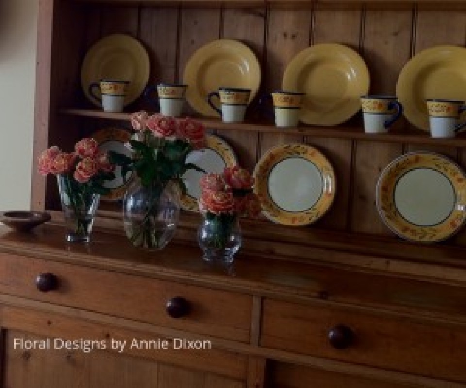 Display of roses on kitchen dresser