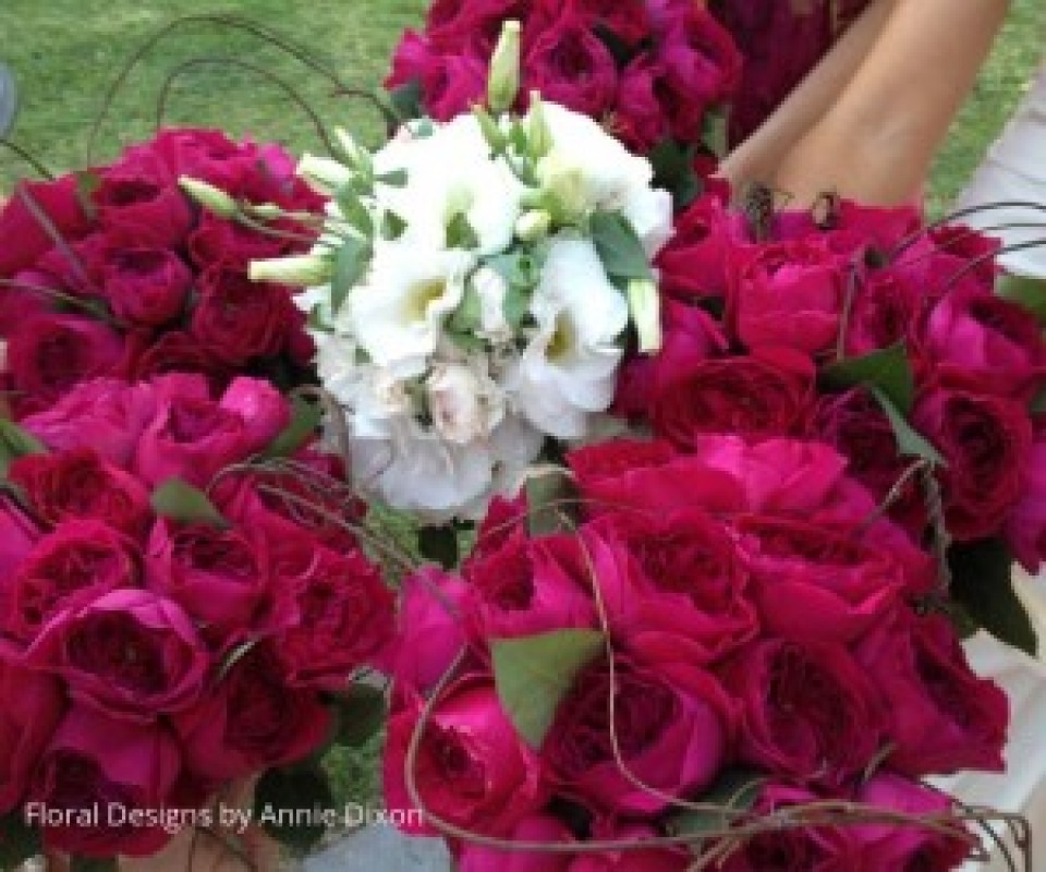 Bride's and bridesmaids' posies of burgundy David Austin roses