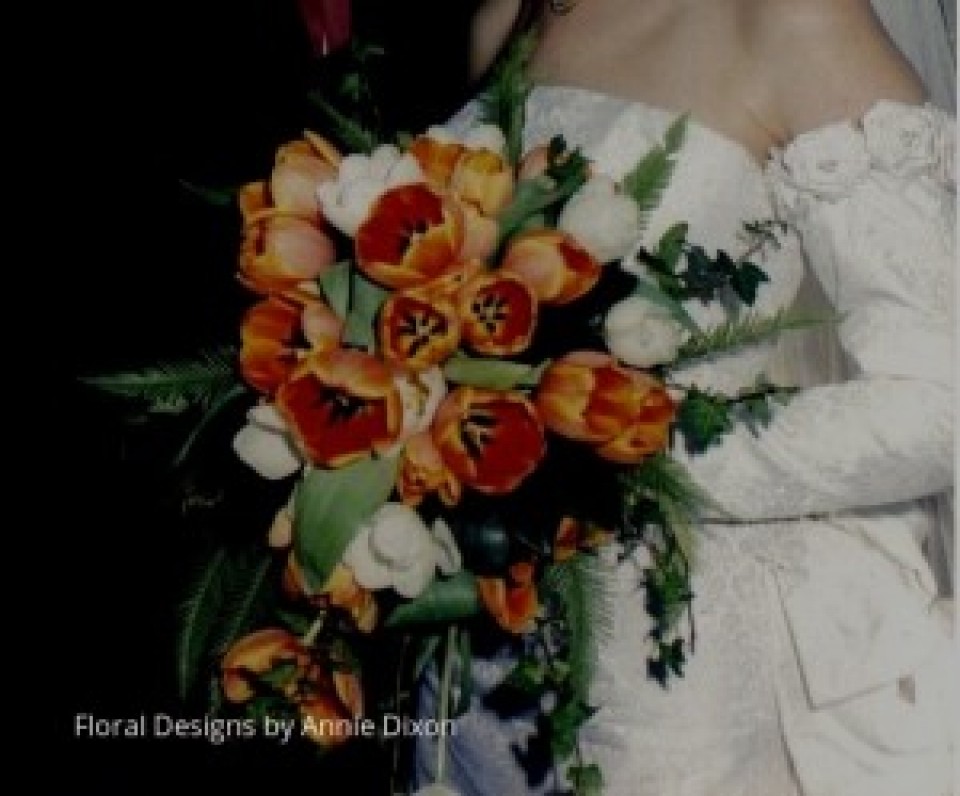 Trailing bridal bouquet of orange tulips