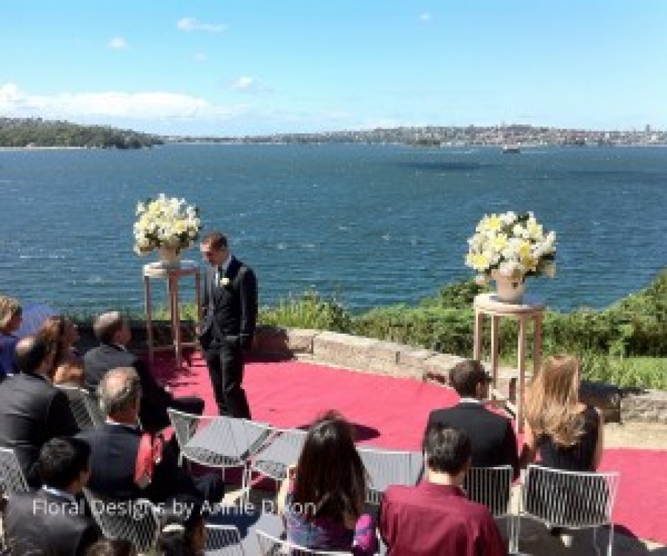 Two pedestal arrangements for outdoor wedding ceremony at Sergeants Mess