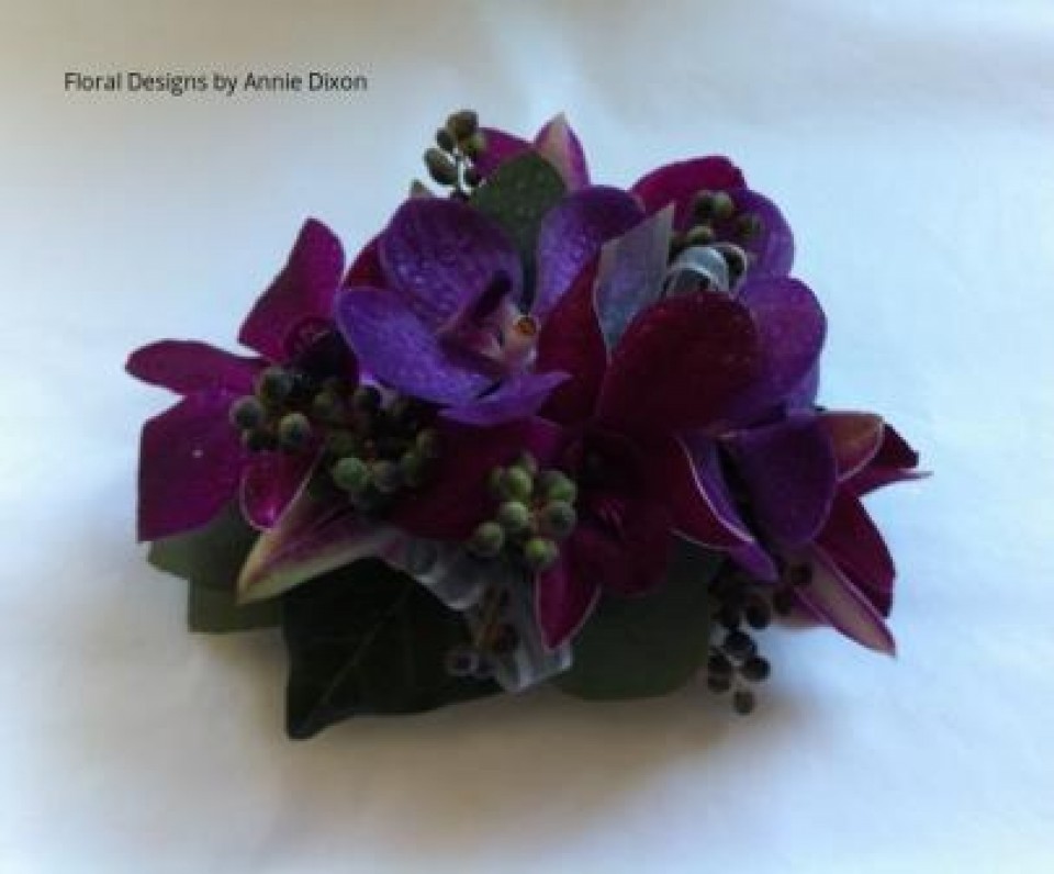 Purple orchid corsage with autumn berries