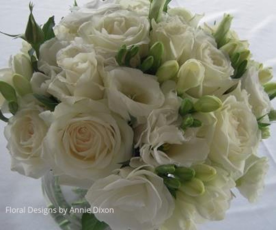 Ivory bouquet of freesias, roses and lisianthus