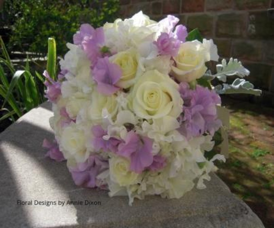 Posy of lilac sweet peas and roses